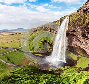 Charming beautiful waterfall Seljalandsfoss in Iceland. Exotic countries. Amazing places. Popular tourist atraction photo