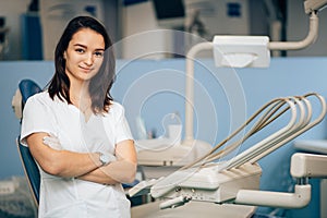 Charming beautiful woman dentist at work place