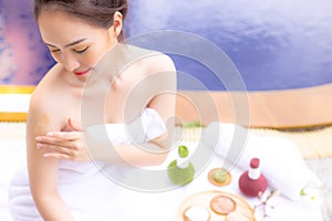 Charming beautiful woman use herbal scrubs for scrubbing skin ce