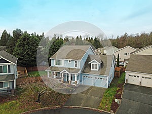 Charming blue two story home with a nice covered porch.