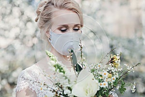 Charming bride in protective mask