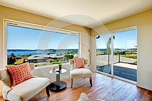 Charming bright living room with walkout deck and amazing window