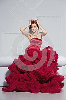 Charming brunette posing in a studio