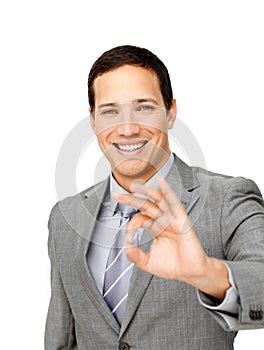 Charming businessman showing OK sign