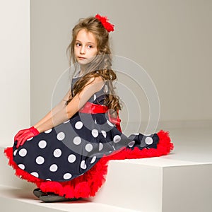 Charming Coquettish Girl Posing in Retro Fashion Dress in Studio