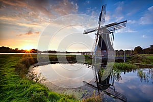 Charming Dutch windmill at sunset