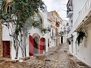 Charming empty cobblestone street of old town of Ibiza. Spain
