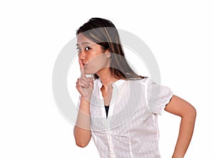 Charming ethnic young woman requesting silence photo