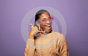 Charming fashionable young black woman 20s wears casual over violet color background