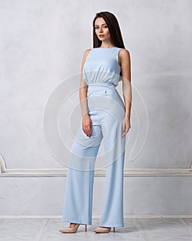 Charming female model in blue jumpsuit