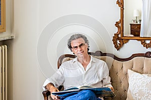 Charming forties with glasses in living room