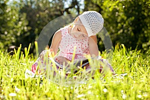Charming girl in the hat reading a book
