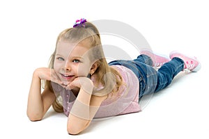 Charming girl lying on floor hands under her chin
