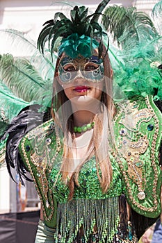 Charming italian woman in Venetian green costume mask dress