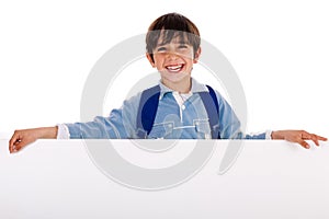 Charming kid holding blank board