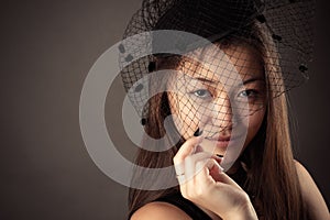 Charming Korean teenager girl with veiled face
