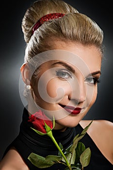 Charming lady with red rose