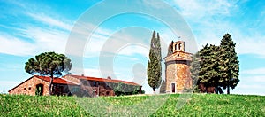 Charming landscape with chapel of Madonna di Vitaleta near rape fiald on a sunny day in San Quirico d`Orcia Val d`Orcia in