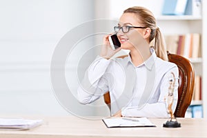 Charming lawyer sitting at the table