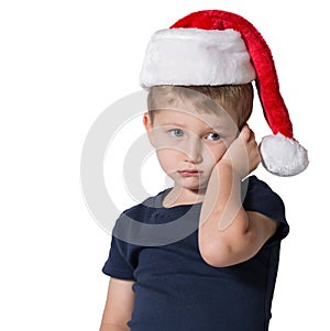 The charming little boy in red cap of Santa Claus