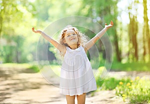 Charming little girl enjoying summer sunny day photo