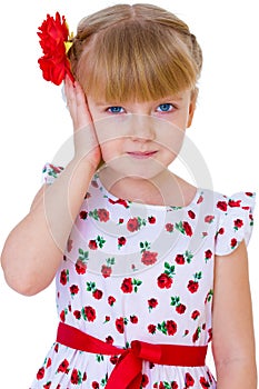 Charming little girl with red rose in hair braided
