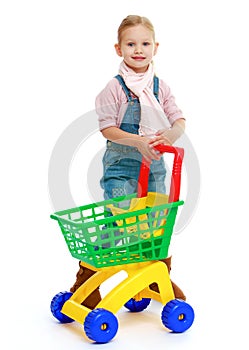 Charming little girl with a toy truck.