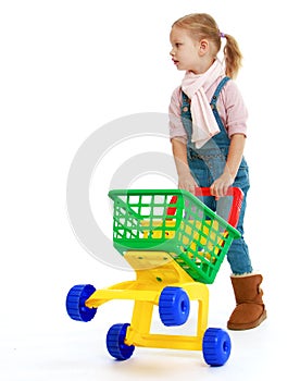 Charming little girl with a toy truck.