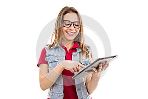 Happy teen woman using tablet