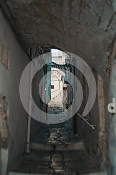 Charming Narrow Alleys of Ostuni: Protective Walls, Houses, and Crossbeams View