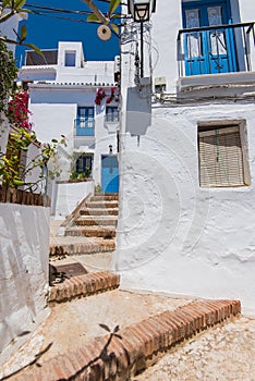 Charming narrow historic streets of white village Frigiliana. photo