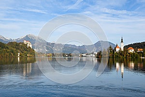 the charming natural scenery of Lake Bled with Alps at background and blue water