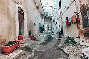 `Charming Neighborhood: Street with Laundry Hanging to Dry