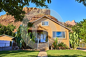 Adobe House and Cacti with Red Rocks Eye Level in Grafton Utah photo