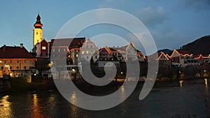 The charming old town of Frohnleiten with Christmas illumination and Mur river, in Styria, Austria, at night