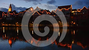 The charming old town of Frohnleiten with Christmas illumination and Mur river, in Styria, Austria, at night