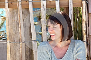 Charming older woman smiling outside