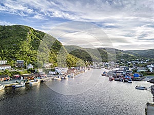 Charming Petty Harbour with green hills and wooden architecture, Newfoundland, Canada