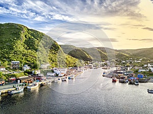 Charming Petty Harbour with green hills and wooden architecture, Newfoundland, Canada