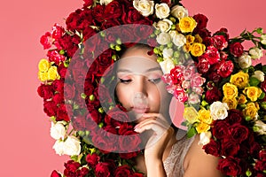 Charming portrait of pensive woman with rose flowers