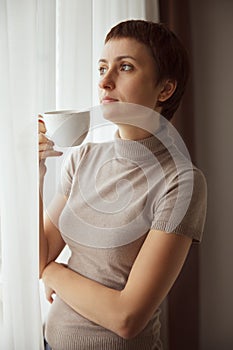 Charming Pretty woman drinking coffee