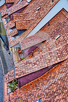 Charming red tiled roofs of medieval houses in old town of Bern, Switzerland