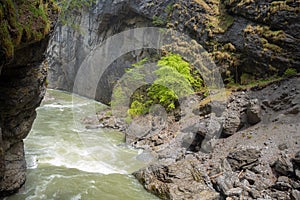 Charming scene of small flowing river in the Aare Gorge Aareschlucht in the vally of Hasli