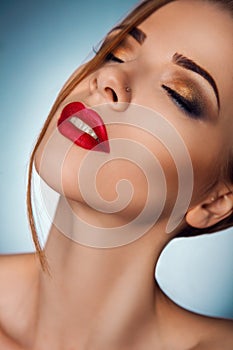 Charming sensual woman with closed eyes in studio