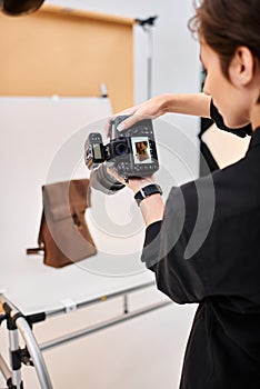 charming short haired female photographer taking