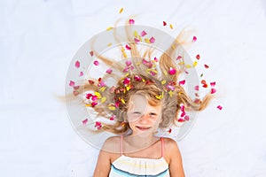 Charming smiling young child with floral adornment hairdo copy space