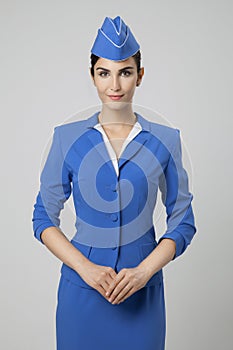 Charming Stewardess Dressed In Blue Uniform