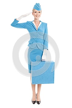Charming Stewardess Dressed In Blue Uniform And Suitcase On White