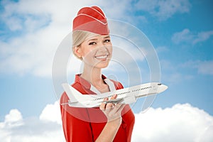 Charming Stewardess Holding Airplane In Hand.