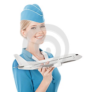 Charming Stewardess Holding Airplane In Hand. Isolated